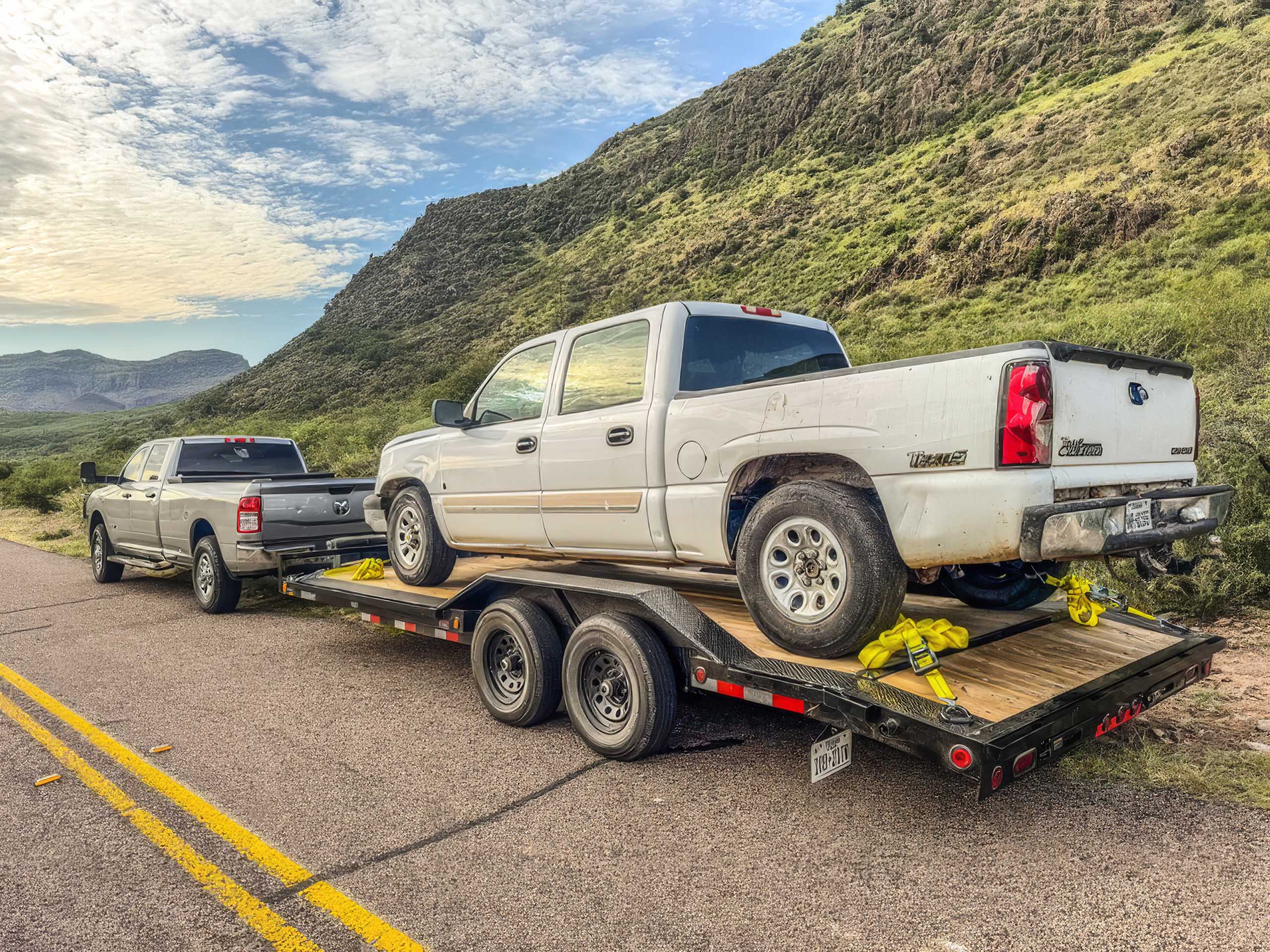 Car hauler trailer showing safety chains and adjustable coupler - G5 Trailer Rentals