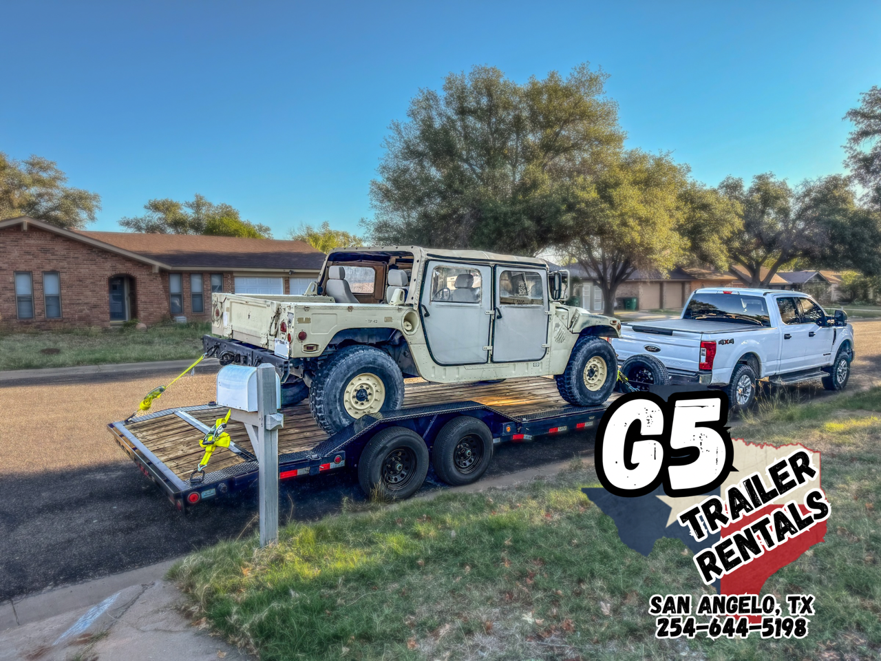 White Hummer military vehicle loaded on G5 flatbed trailer rental in San Angelo