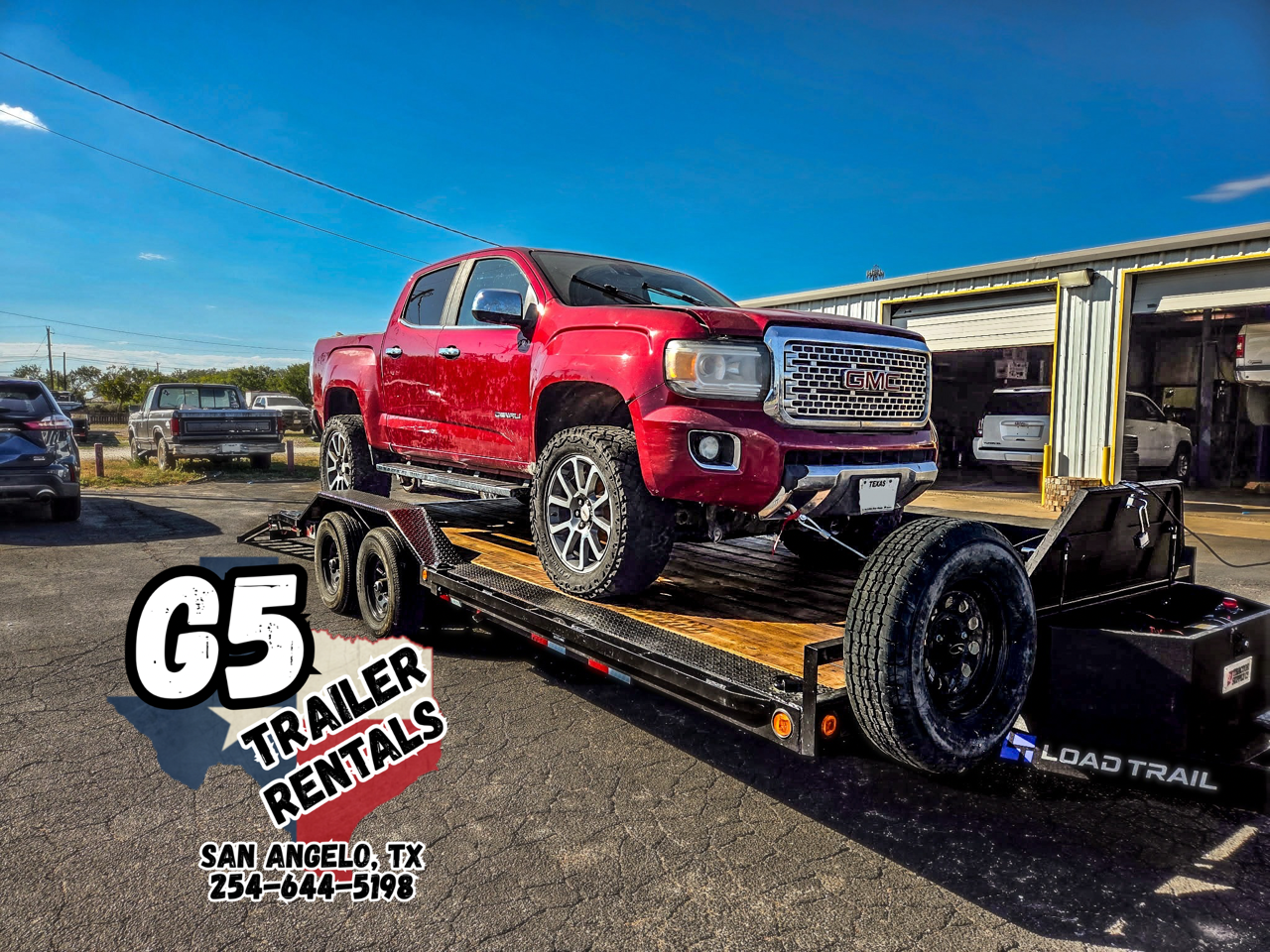 Red GMC truck on Load Trail car hauler trailer rental - G5 Trailer Rentals San Angelo TX